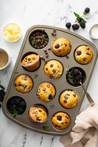 Blackberry and chocolate chip muffins in a baking pan, summer berry recipe