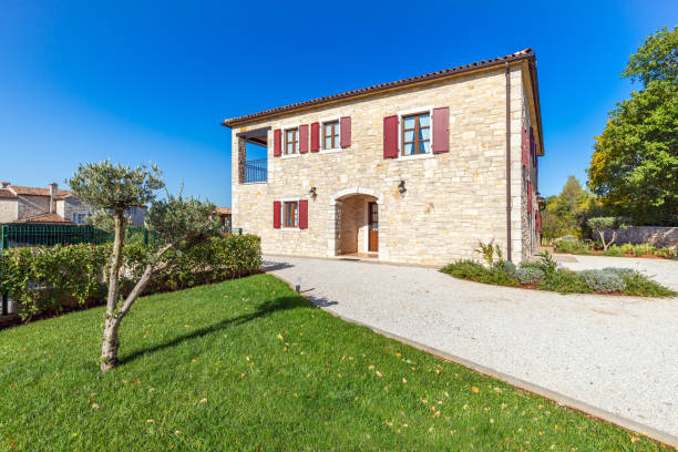 istock Luxurious beautiful modern villa with swimming pool and yard garden 1351168587