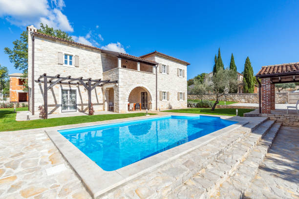 istock Luxurious beautiful modern villa with swimming pool and yard garden 1351168621