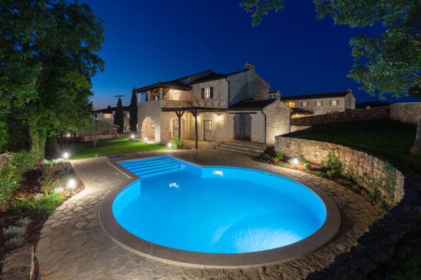 istock Luxurious beautiful modern villa with swimming pool and yard garden 1351168633
