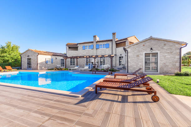 Luxurious beautiful modern villa with swimming pool and yard garden stock photo