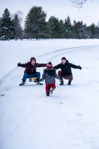 istock Family playing outside during winter. 1351171208