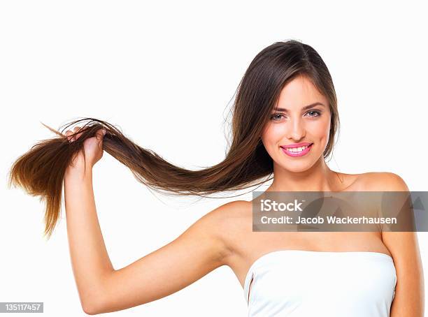 A Woman Holds Her Hair Against A White Background Stock Photo - Download Image Now - Strength, Human Hair, White Background