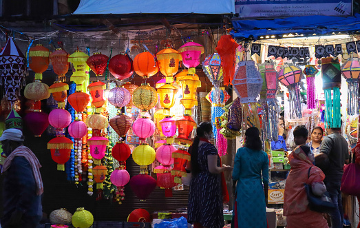 A Selectively focused of a Street shop selling colorful Lanterns which are used in decorating homes of Hindus for the Diwali festival in India.
