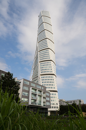 Malmo, Sweden - November 3, 2021: Turning Torso skyscraper is the tallest building in Scandinavia with 190 metres and the most recognizable landmark for Malmo. Exterior view. Selective focus.