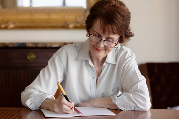 istock Woman with pen and notepad thinking what to write 1351186253