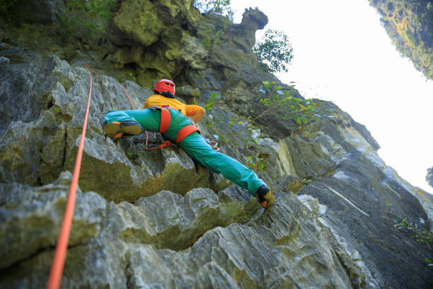 istock Female rock climber on cliff 1351193016