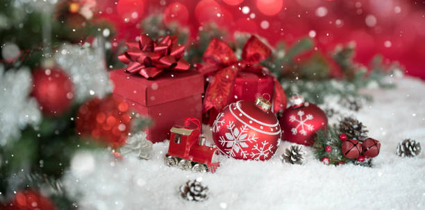 istock Christmas Gifts and Baubles on a Red Background 1351193134