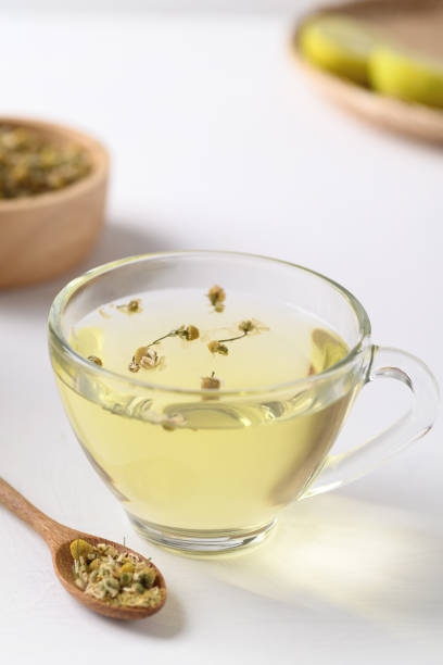 istock Chamomile tea in a cup glass with dried chamomile flowers 1351193871