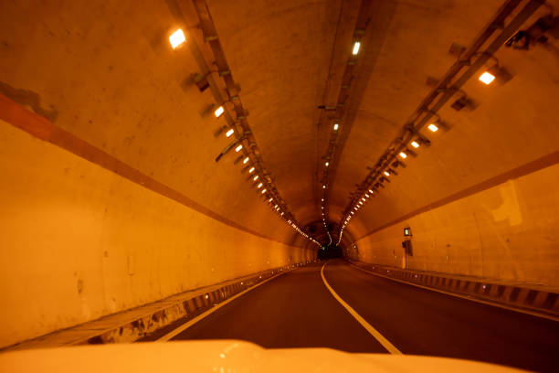 istock Driving car in high way tunnel 1351194022