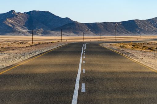 Wind-swept road in the Namib Desert, Namibia, near Luderitz and the Skeleton Coast