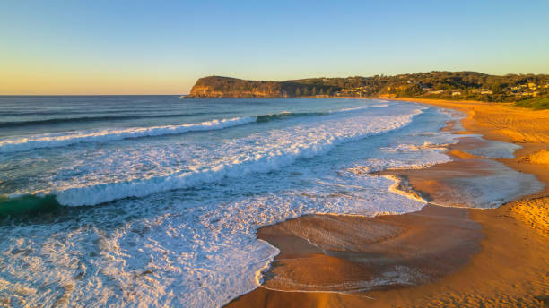 istock Surfs up aerial sunrise seascape 1351195546