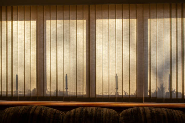 istock Abstract background of candle stick silhouettes in a modern window 1351202931