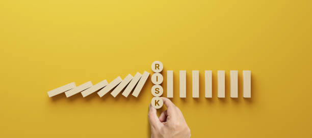 risk management concept. top view wooden block stopping domino effect for business. 3d render illustration - risk management imagens e fotografias de stock