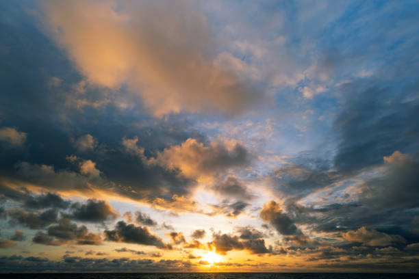 istock Dark clouds over sea at sunset Dramatic thunderstorm landscape with building clouds Natural rainy dark sky Amazing for nature composition background 1351204856