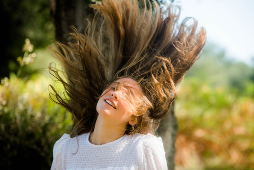 portrait of a beautiful young woman in an autumnal landscape