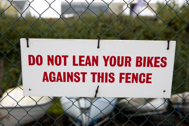 istock Do not park bicycles notice on a wire fence 1351209921