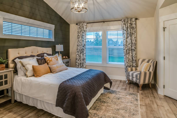 istock Beautifully decorated bedroom and window coverings 1351210773