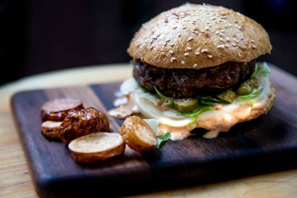 istock Homemade juicy beef burger in a sourdough bun 1351214324