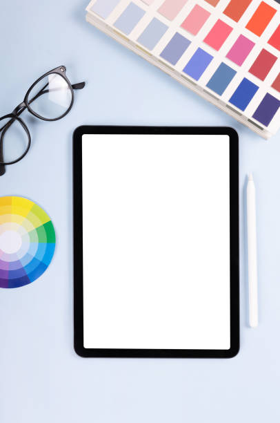 istock iPad pro with white screen on white color background. Flatlay. Office background 1351218513