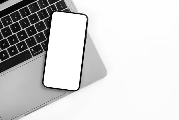 istock New Phone on a laptop background. 1351218527