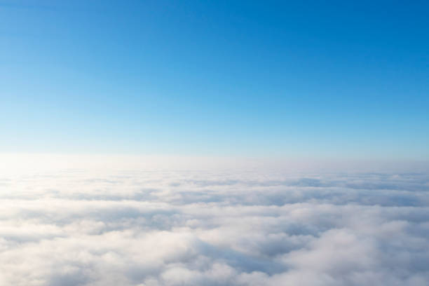 istock Aerial view white clouds in blue sky. View from drone. Aerial top view cloudscape. Texture of clouds. View from above. Panorama sky 1351220577