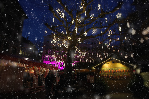 Christmas market tree decoration lights snow in Switzerland