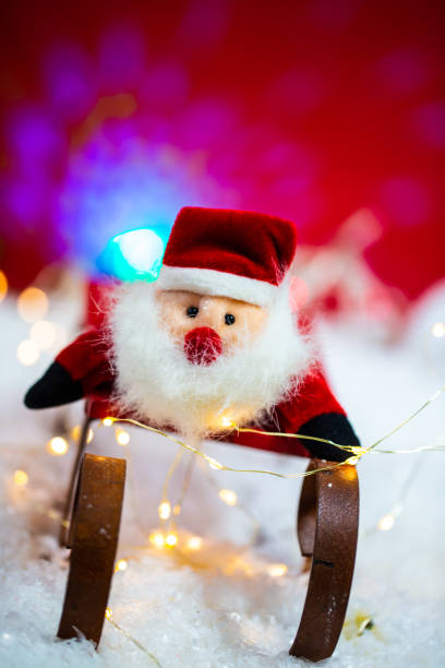 istock funny santa claus on sledge, merry christmas 1351223501