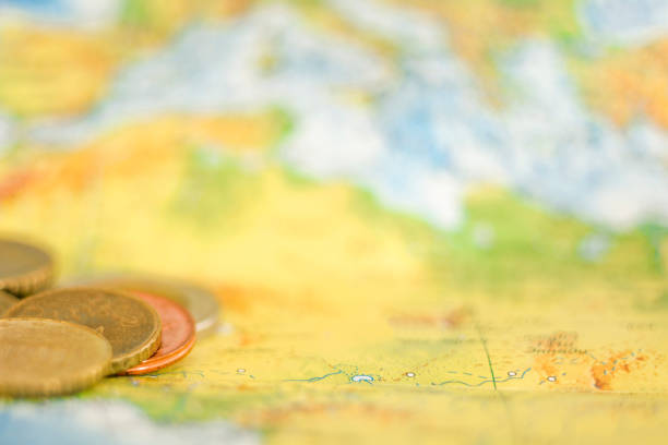 istock Gold coins on the world map 1351225175