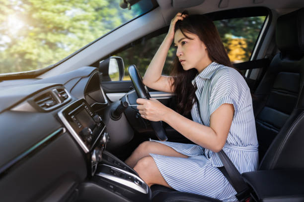 istock stressed woman driver sitting inside car 1351233134