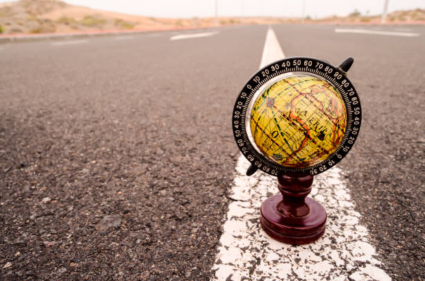 istock Globe Earth on an Asphalt Street 1351233326