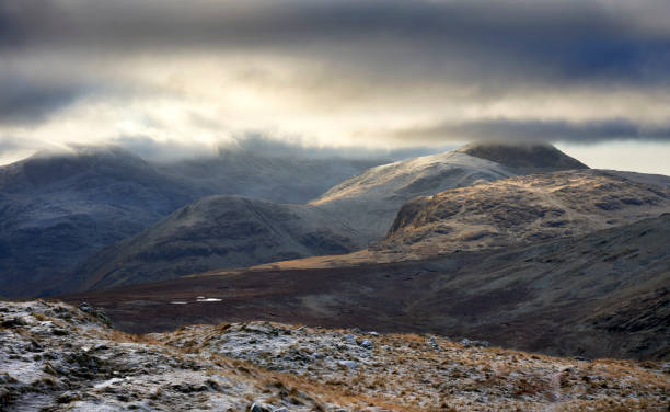 istock Cloud covered mountain of Great Gable on a cold winters morning 1351233541