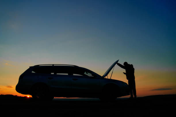 istock Man With Car Trouble Texting For Roadside Assistance 1351234556