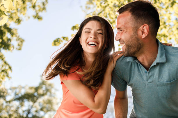 istock Cheerful couple enjoying in springtime in nature. 1351237345