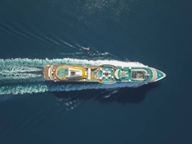 aerial view large cruise ship at sea, passenger cruise ship vessel, sailing across the ksamil, albania. view from drone. - cruzeiro imagens e fotografias de stock