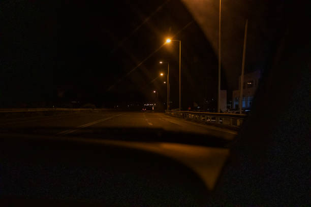 istock night road in the windshield of a car, horizontal 1351237862