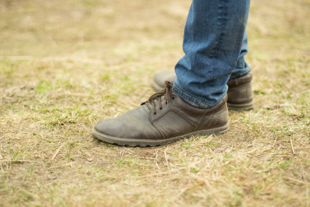 istock Leather boots and blue jeans. Classic fashion. 1351238183