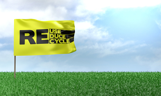 3D Render Recycle, Reuse, Reduce message on flag on green grass. Sustainability and Environment concept.