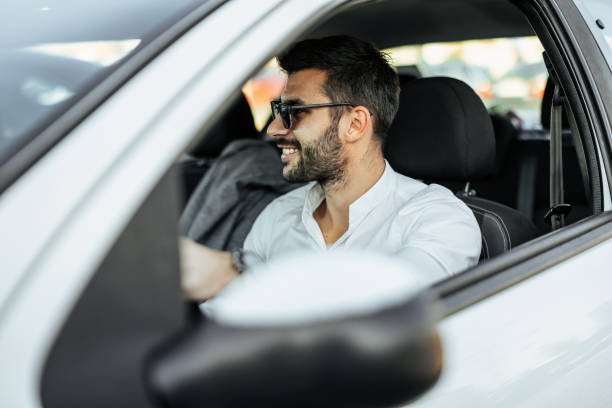 istock Man driving his car 1351241350