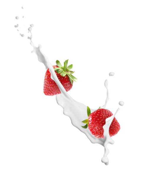 istock Fresh strawberries with milk splash on white background 1351241828