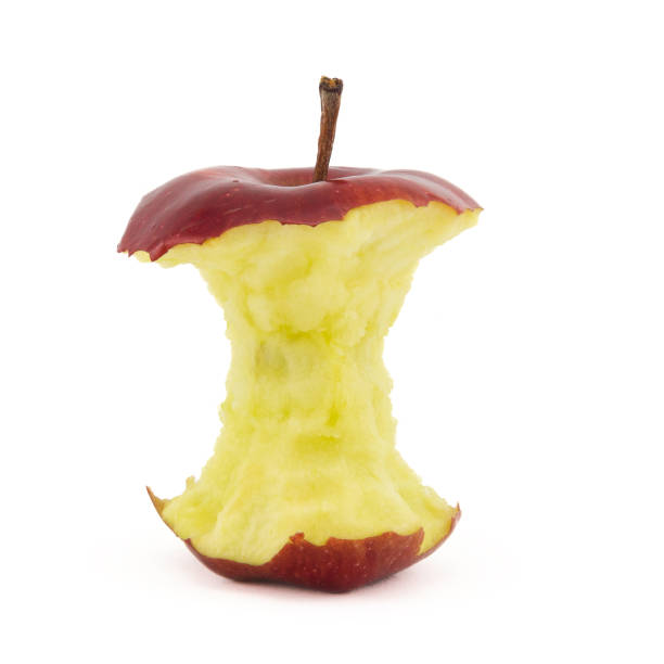 maçã mordida vermelha. núcleo de maçã maduro - rotting apple fruit missing bite - fotografias e filmes do acervo