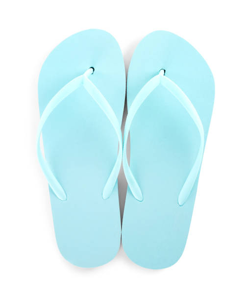 istock Light blue flip flops isolated on white, top view. Beach accessory 1351248229
