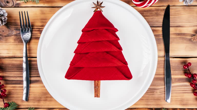Step-by-step stop motion video tutorial: How to fold linen napkin in shape of Christmas tree. Top view