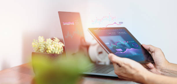 istock On a virtual screen, A businessman is constructing a business graph and analyzing financial data on a tablet computer. Concept of business planning and strategy 1351249677