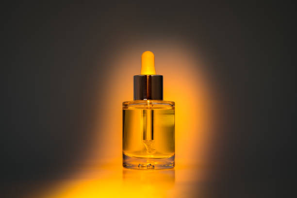 istock Yellow face oil in orange spotlight 1351249682