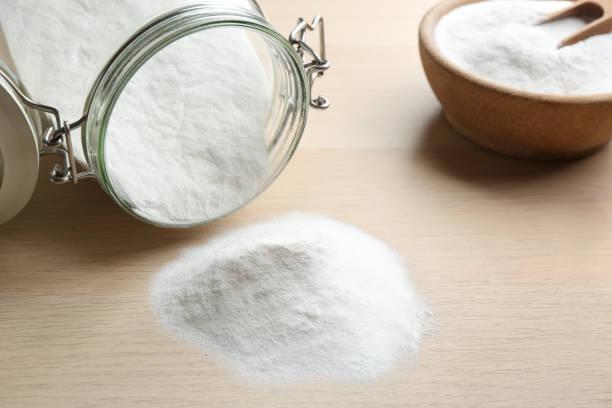 istock Pile of baking soda on wooden table 1351249894