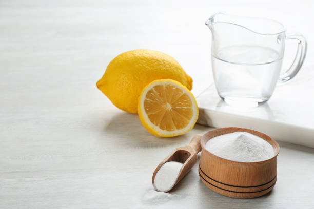 istock Composition with baking soda and cut lemons on white wooden table 1351249895