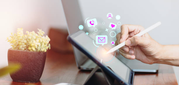 istock On social networking, a man uses a tablet computer to talk, post, and message. Business marketing and smart communication technologies 1351250262
