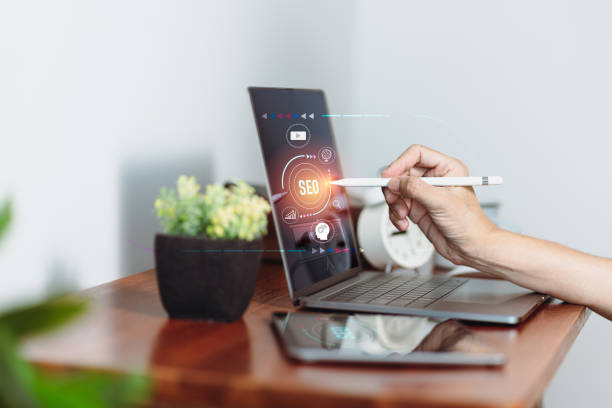 istock Using a smartphone and a tablet computer for SEO and digital marketing media based on network technologies 1351250329