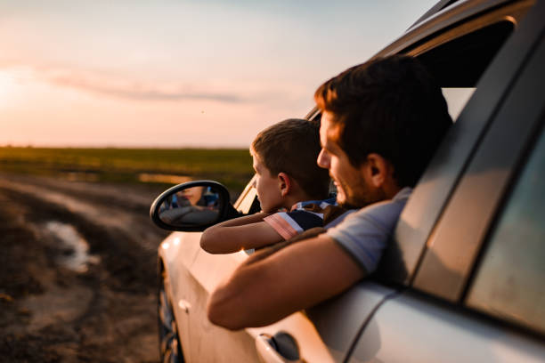 istock Beautiful father and son enjoying on a road trip 1351252957